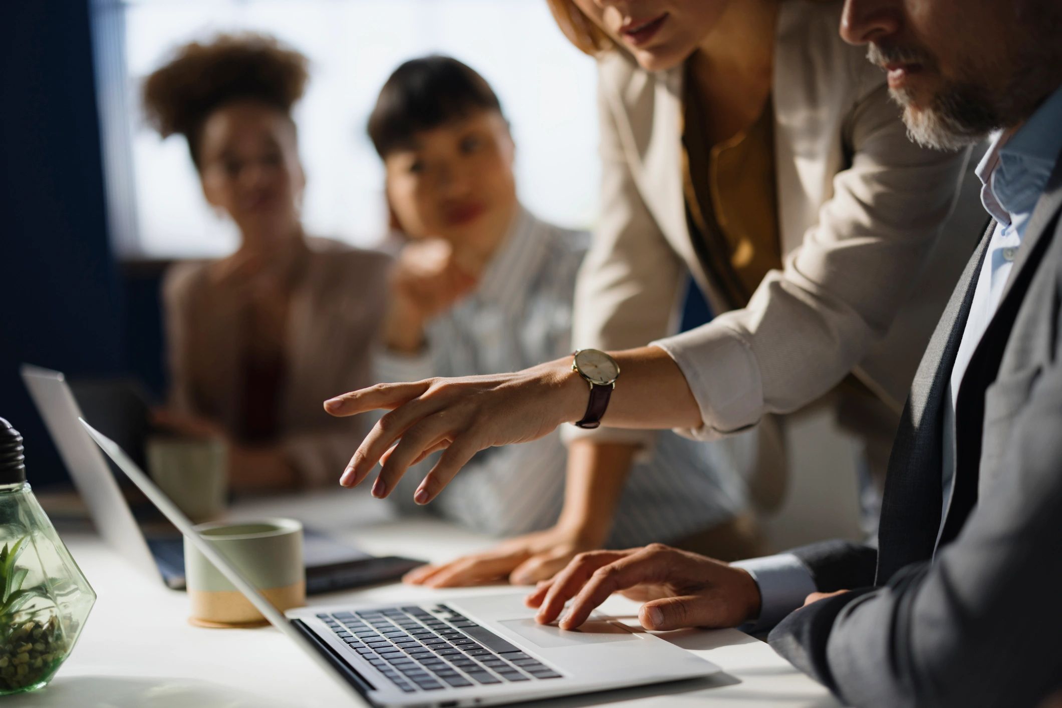 Business colleagues reviewing an email on a computer