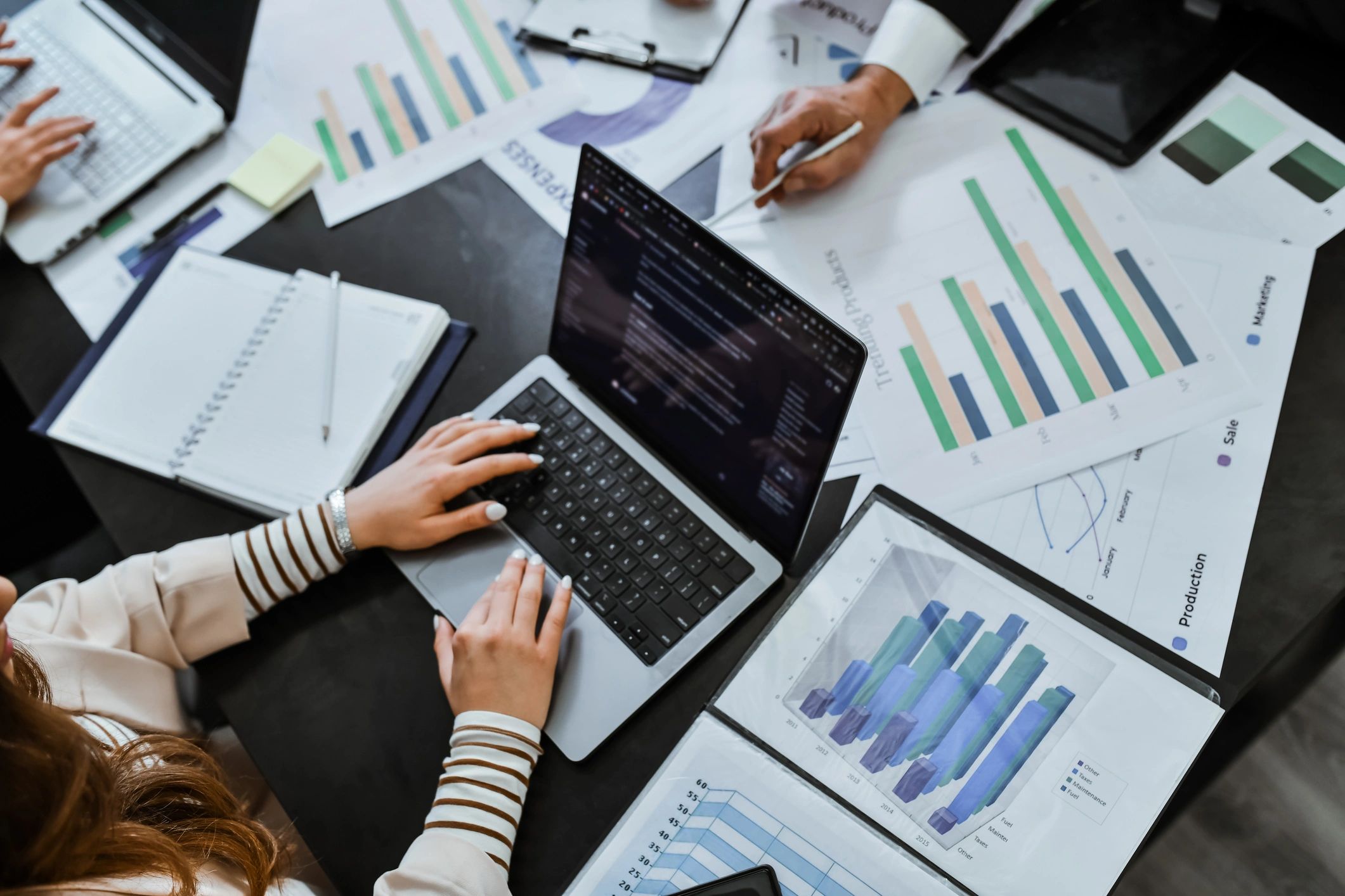 Marketing team reviewing performance analytics on a laptop