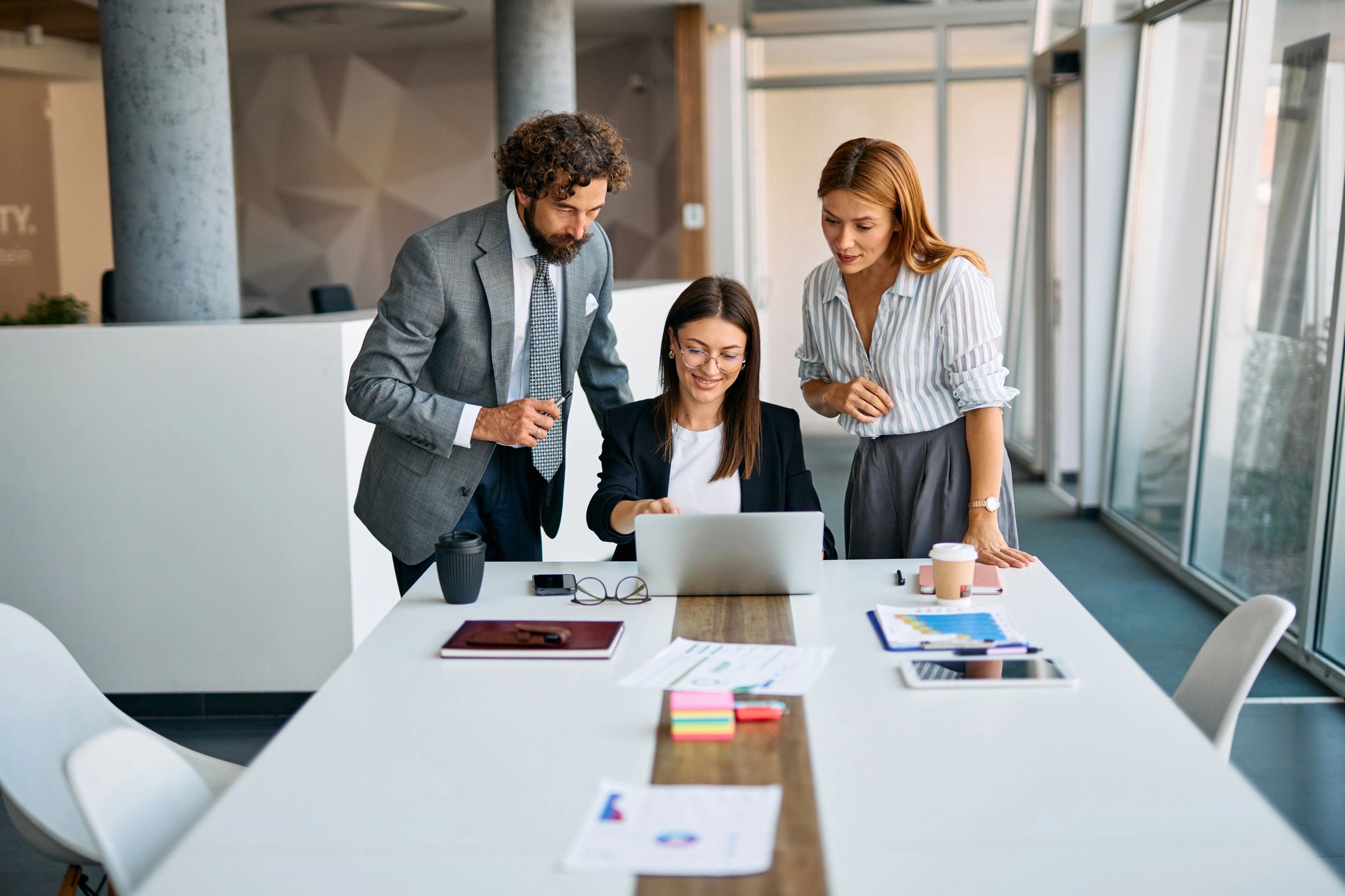 Business professionals collaborating at a meeting table